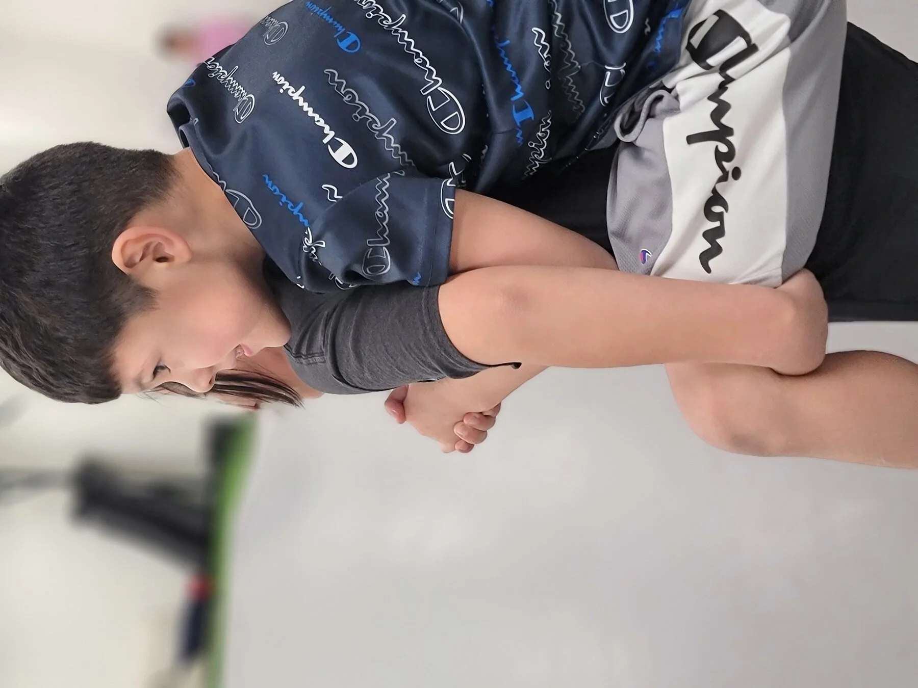 Kids lined up with instructor — CJJF patches visible