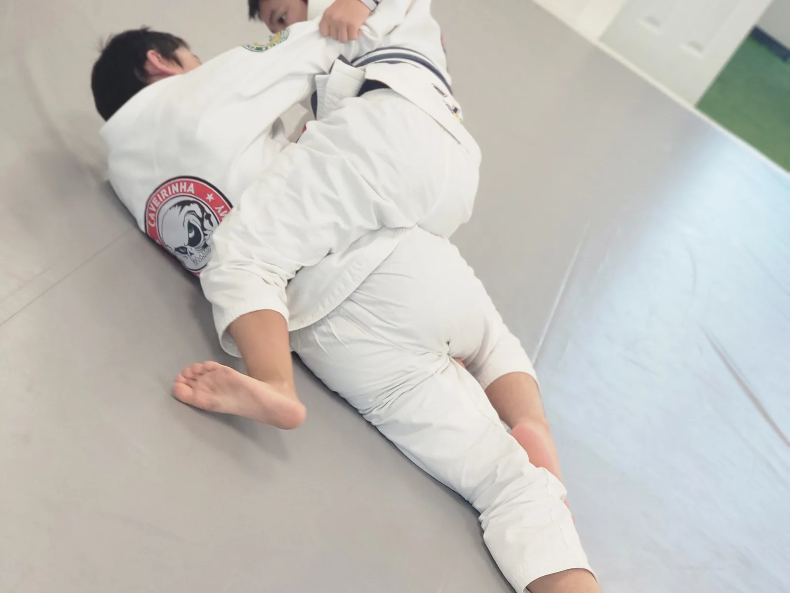 Teens rolling on the mat at CJJF Las Vegas