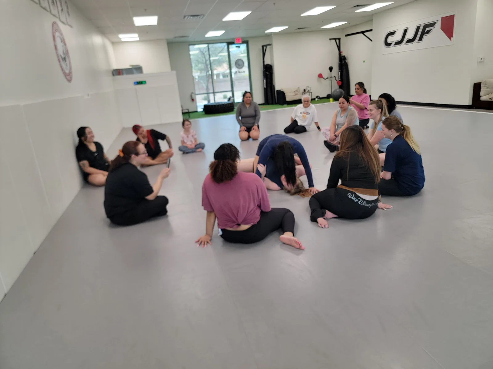 Women's BJJ class training together at CJJF